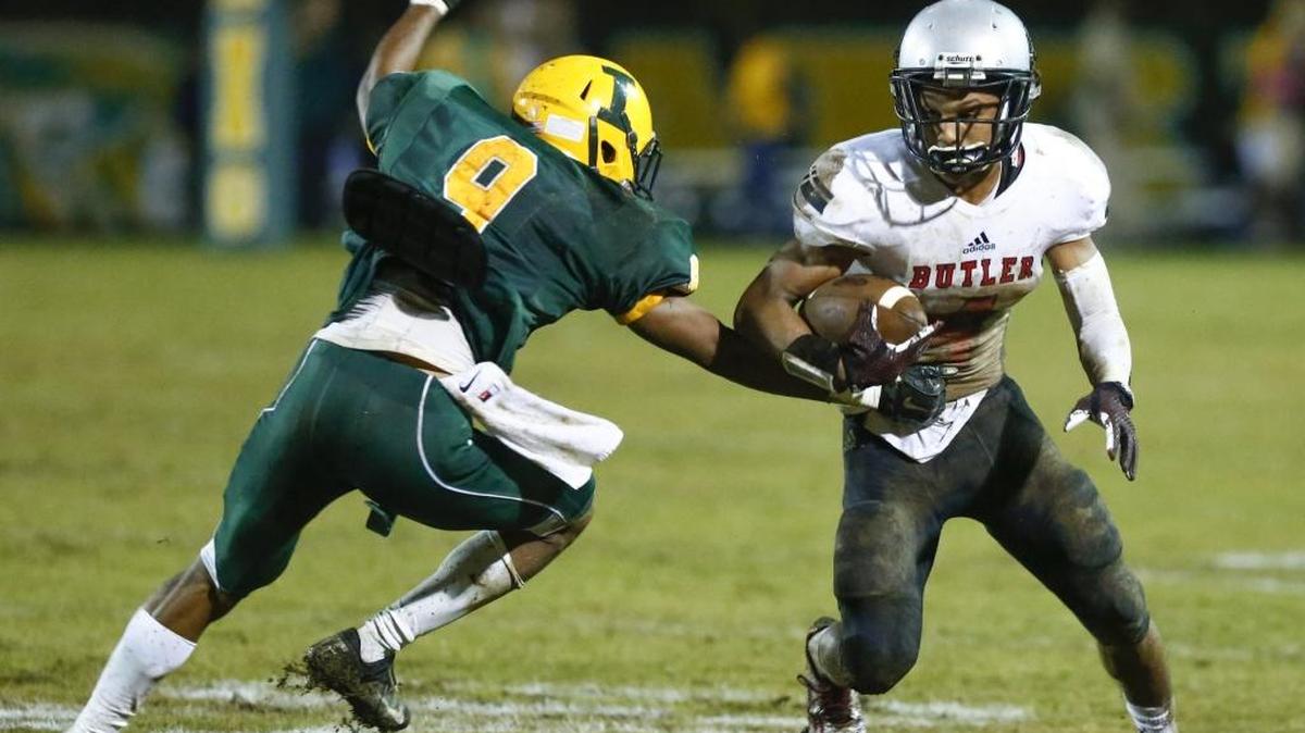 Former Butler High star Clifton Duck, right, is pictured last season against rival Independence in the the Southwestern 4A championship game. Duck, now a freshman cornerback at Appalachian State, will make his college debut at No. 9 Tennessee Thursday night.