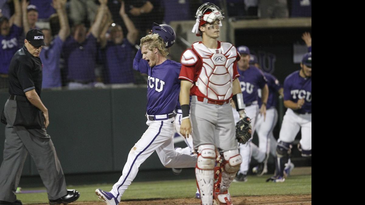 
TCU's Evan Williams scores the winning run off a single by teammate Elliott Barzilli as N.C. State catcher Andrew Knizner (11) walks off in the tenth inning at the Fort Worth Regional of the NCAA college baseball tournament. TCU won 9-8. 

