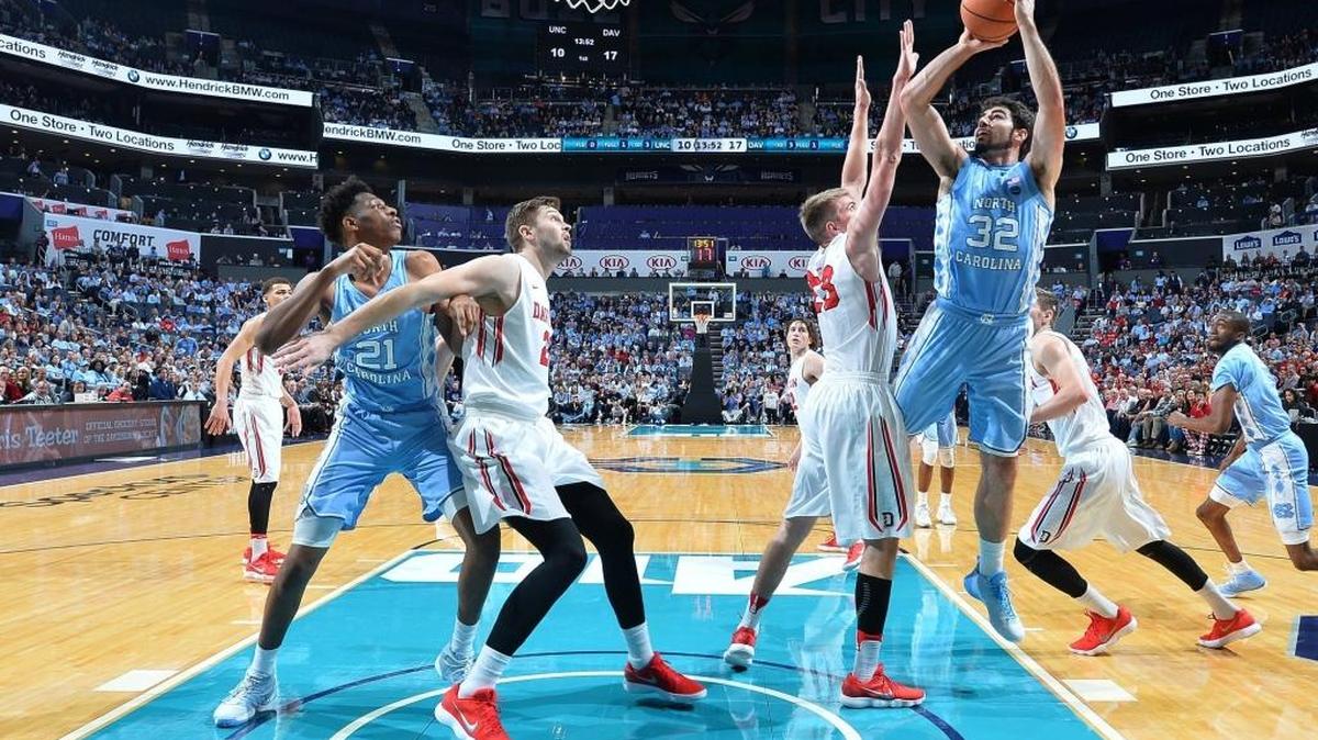 North Carolina forward Luke Maye scores two of his 24 points points over Davidson’s Peyton Aldridge early in first half of Friday night’s basketball game at Spectrum Center.