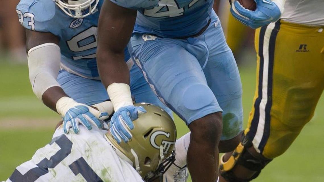 
North Carolina’s Junior Gnonkonde (44) returns a fumble by Georgia Tech quarterback Justin Thomas (5) in the fourth quarter on Saturday.
