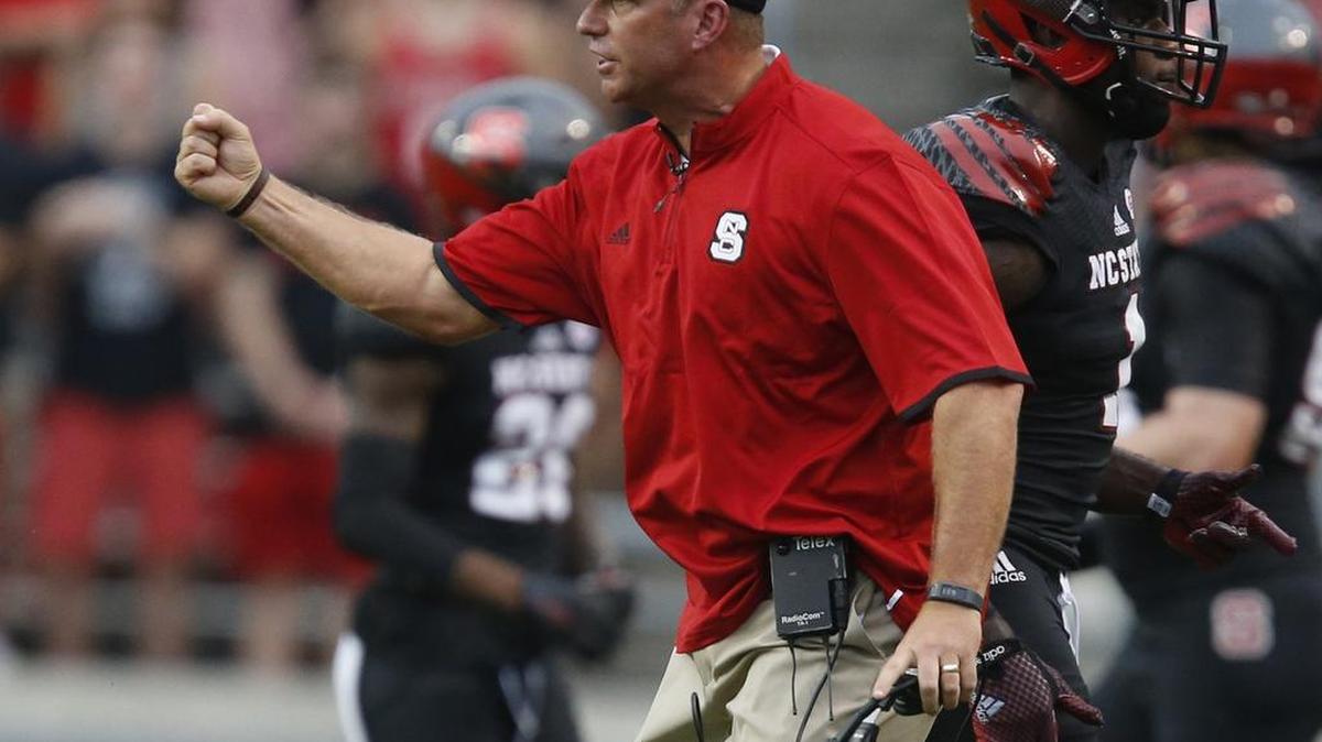 
N.C. State head coach Dave Doeren is pumped for the play of his team during the first half of the Wolfpack's game against Eastern Kentucky at Carter-Finley Stadium in Raleigh, Saturday, Sept. 12, 2015.
