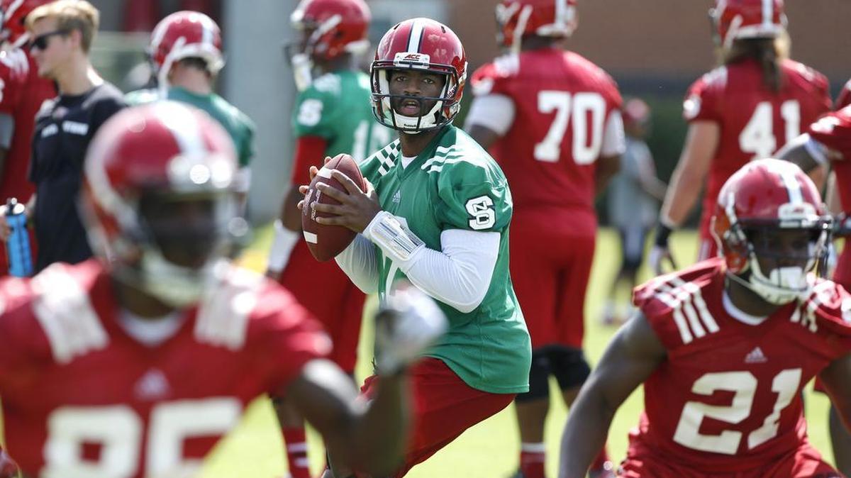 
N.C. State quarterback Jacoby Brissett (12) prepares to pass during the Wolfpack's first preseason practice Tuesday, August 4, 2015, in Raleigh.
