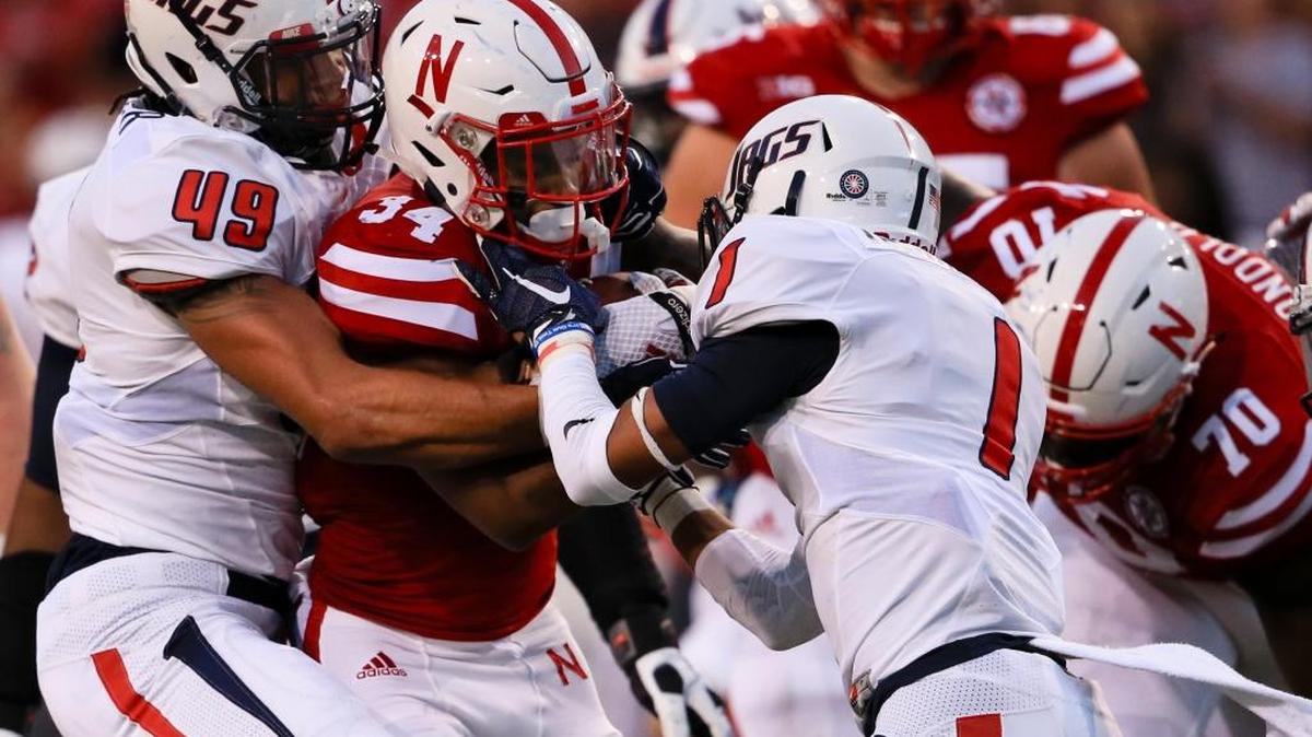 
Nebraska running back Terrell Newby (34) is tackled by South Alabama linebacker Demarius Rancifer (49) and cornerback Jalen Thompson (1) during the first half of an NCAA college football game in Lincoln, Neb., Saturday, Sept. 12, 2015. 
