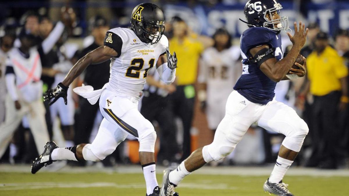 
Georgia Southern running back Matt Breida (36) outruns Appalachian State defensive back Doug Middleton at Paulson Stadium in Statesboro, Ga.


