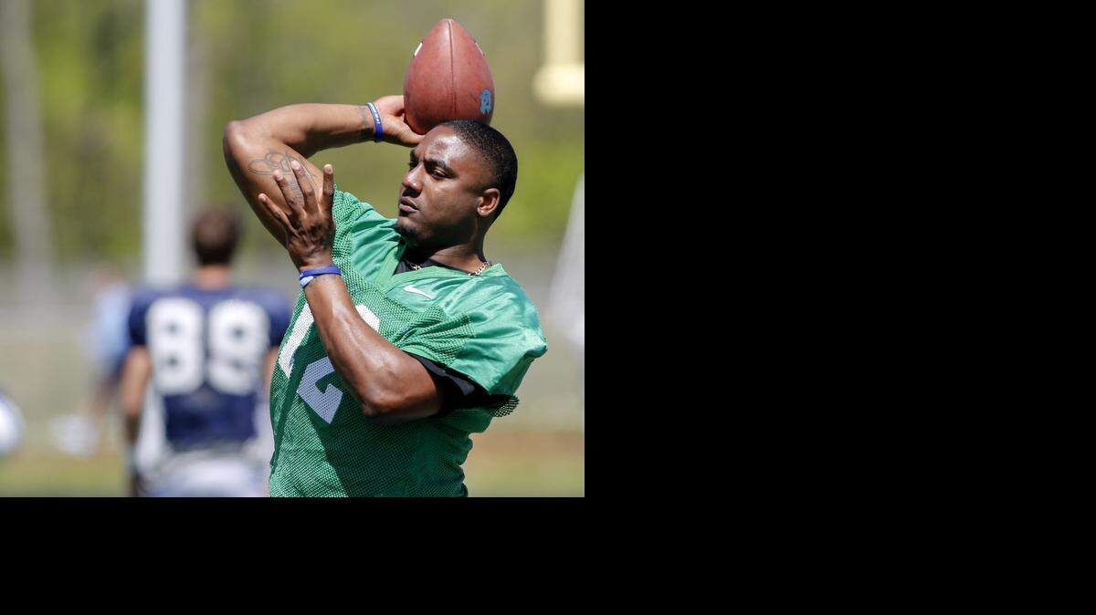 
North Carolina quarterback Marquis Williams throws a pass on the sidelines before the start of the Tar Heels' final spring football scrimmage, at Rocky River High School in Mint Hill Saturday, April 11, 2015. (Nell Redmond photo) 

