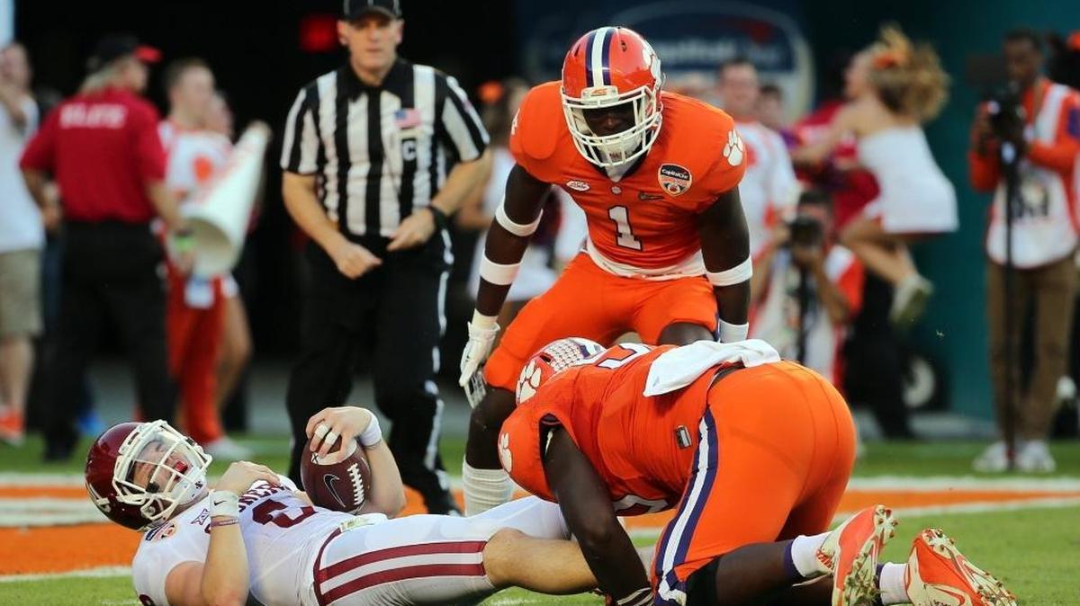 On Thursday, Clemson’s defense played as if to send a message. Jayron Kearse (1) and Shaq Lawson were among Tigers who tormented Oklahoma quarterback Baker Mayfield.