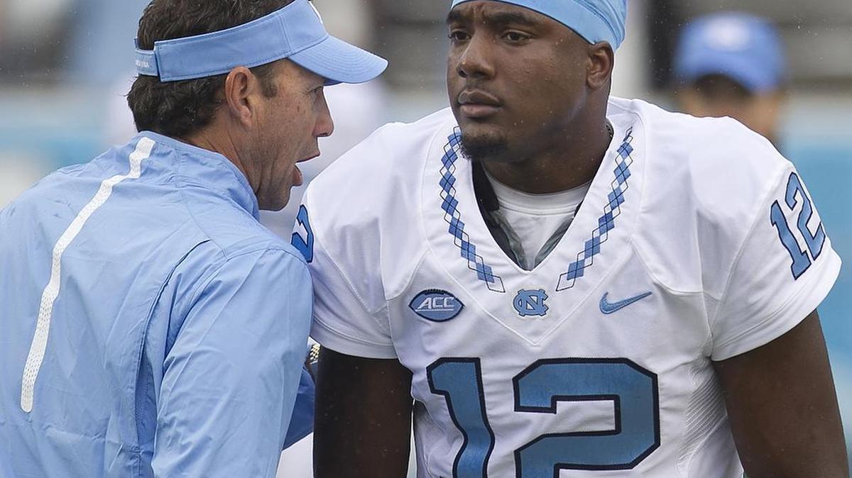 
North Carolina coach Larry Fedora talks with quarterback Marquise Williams (12) prior to the Tar Heels’ game against Delaware on Saturday.
