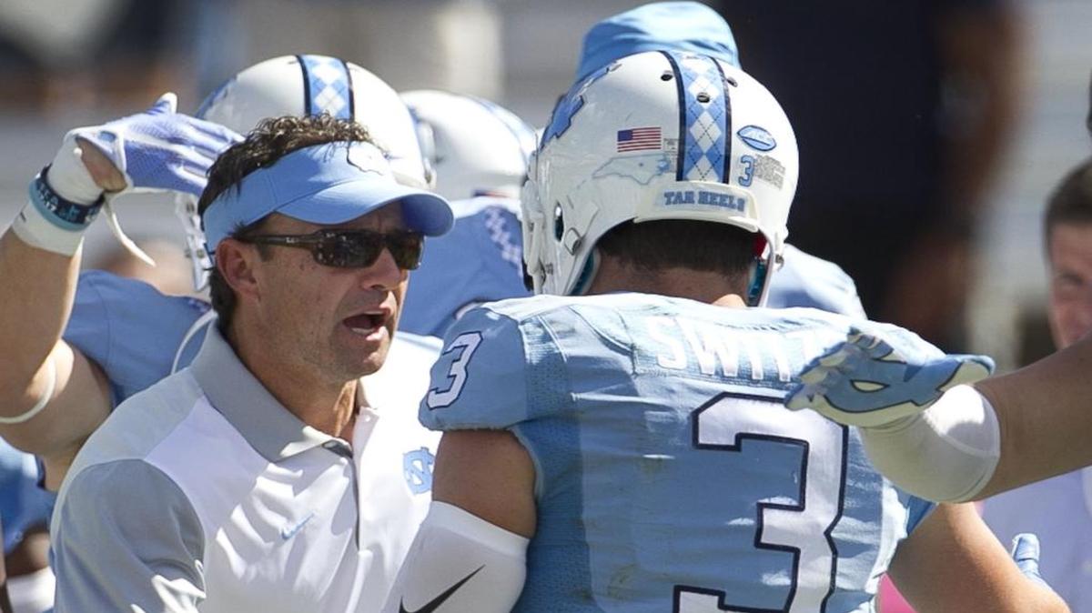 
North Carolina head coach Larry Fedora congratulates Ryan Switzer (3) after his 85 yard punt return for a touchdown in the fourth quarter against Illinois on Saturday, September 19, 2015 at Kenan Stadium in Chapel Hill.
