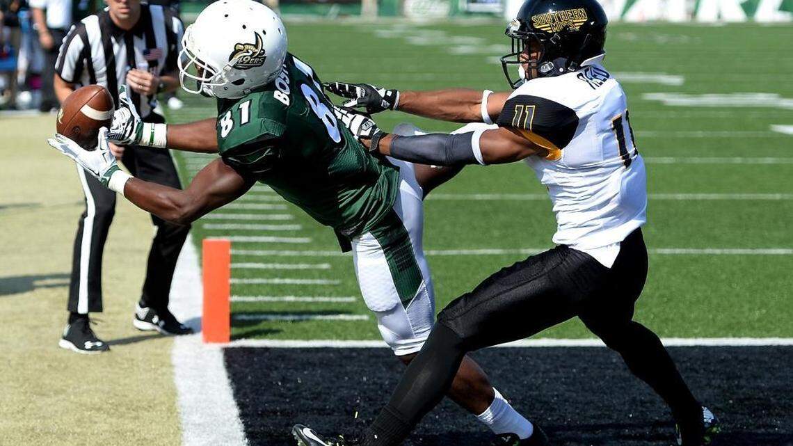 Charlotte 49ers receiver Trent Bostick, left, is unable to maintain control of a pass in the end zone against Southern Miss defensive back Kalan Reed.