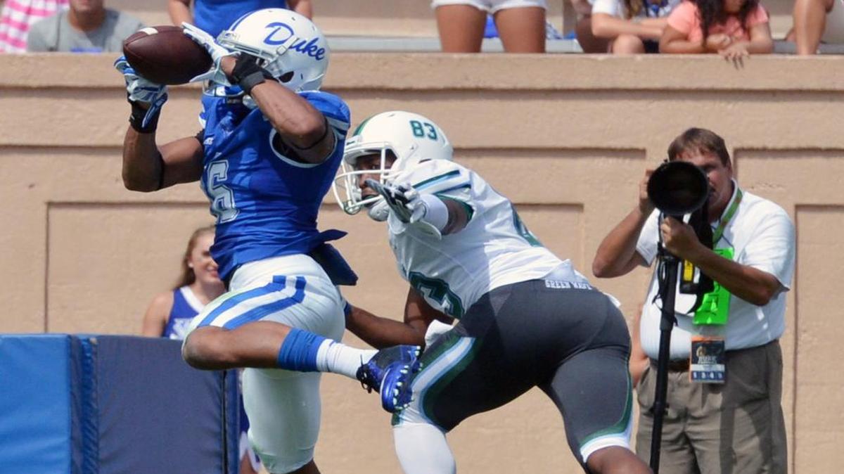 
Duke safety Jeremy Cash (16) intercepts a pass intended for Tulane tight end Trey Scott (83) on Sept. 20, 2014 at Wallace Wade Stadium in Durham.
