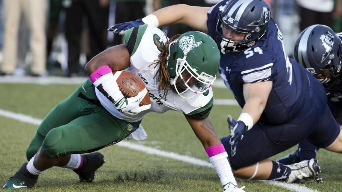 
Charlotte Kalif Phillips is being tackled by ODU Pat Toal during their football game at Foreman Field in Norfolk, Va., on Saturday, Oct. 17, 2015. 
