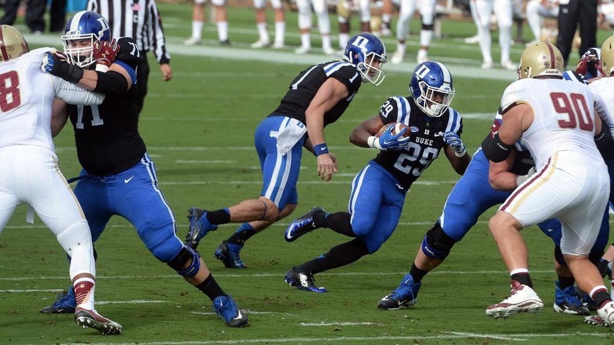 
Duke quarterback Thomas Sirk (1) hands off to running back Shaun Wilson (29) in the first quarter against Boston College.  at Wallace Wade Stadium in Durham.
