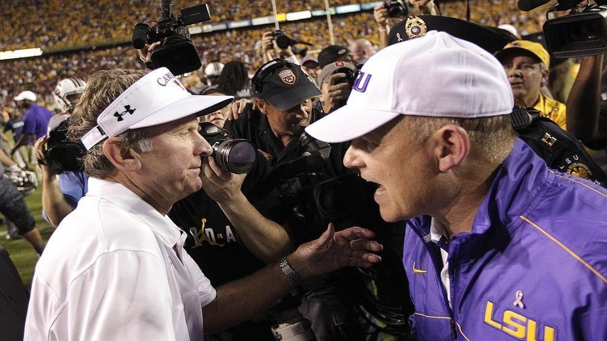 
LSU coach Les Miles, left, greets South Carolina coach Steve Spurrier after an NCAA college football game in Baton Rouge, La., Saturday, Oct. 13, 2012. LSU won 23-21.
