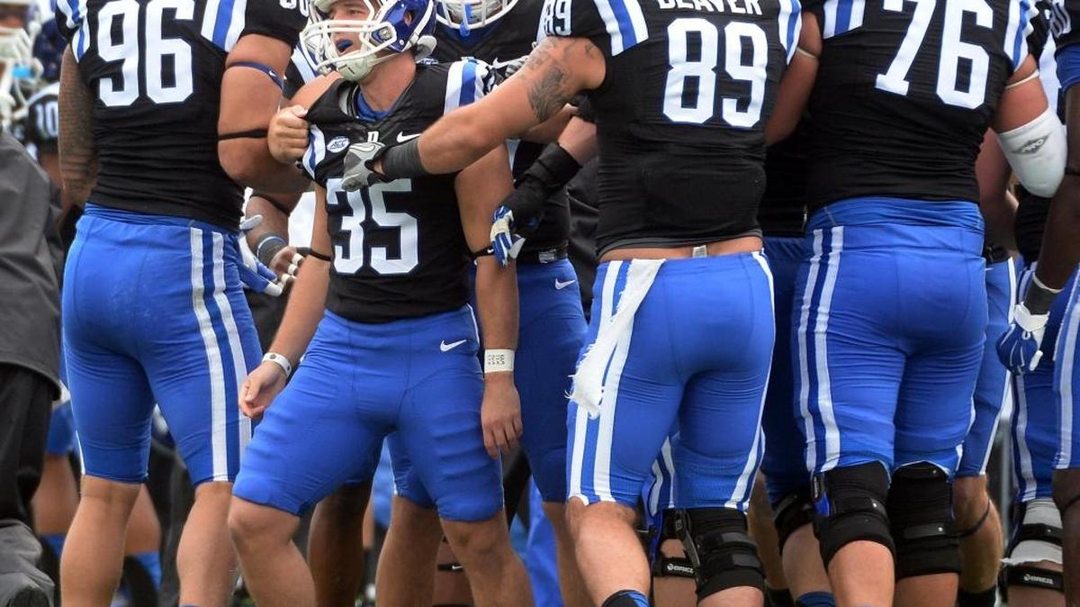 
Duke kicker Ross Martin (35) is congratulated by teammates after kicking what would end up being the winning field goal against the Boston College Eagles. 
