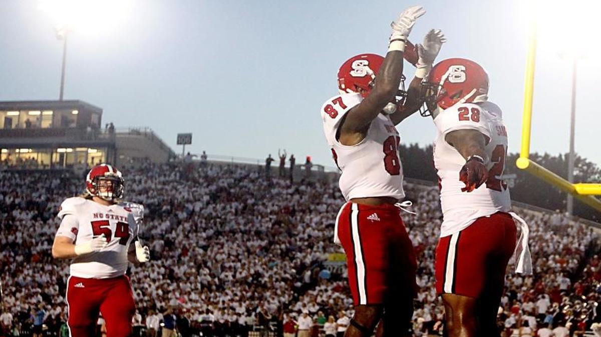 
N.C. State's Maurice Trowell, left, celebrates with Jaylen Samuels after Samuels scored on a three-yard touchdown run against Old Dominion in Norfolk, Va.
