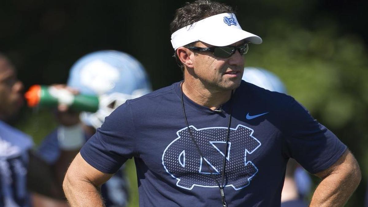
North Carolina head coach Larry Fedora watches his players during the Tar Heels’ first football practice of the season on Monday, August 3, 2015 at Navy Field in Chapel Hill, N.C. 
