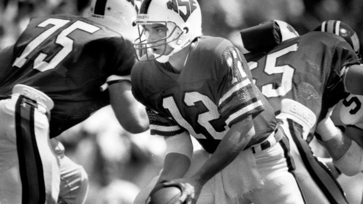 
A 1986 photo shows NC State quarterback Erik Kramer in action against Wake Forest. 
