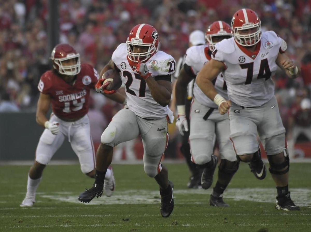 Georgia running back Nick Chubb (27) runs for a touchdown against Oklahoma during the second half of the Rose Bowl NCAA college football game Monday, Jan. 1, 2018, in Pasadena, Calif. (AP Photo/Mark J. Terrill)