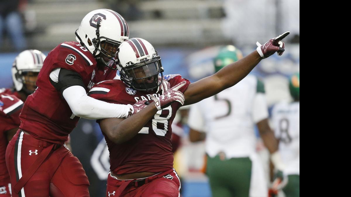 
South Carolina linebacker Jonathan Walton (28) celebrates his interception against Miami at the Independence Bowl in Shreveport, La., Saturday, Dec. 27, 2014.
