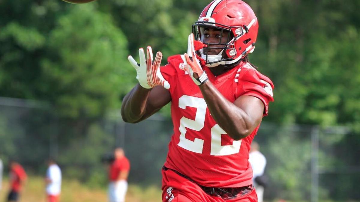 
N.C. State's Johnny Frasier (22) looks to pull in a pass during the Wolfpack's first preseason practice Tuesday, August 4, 2015, in Raleigh. 
