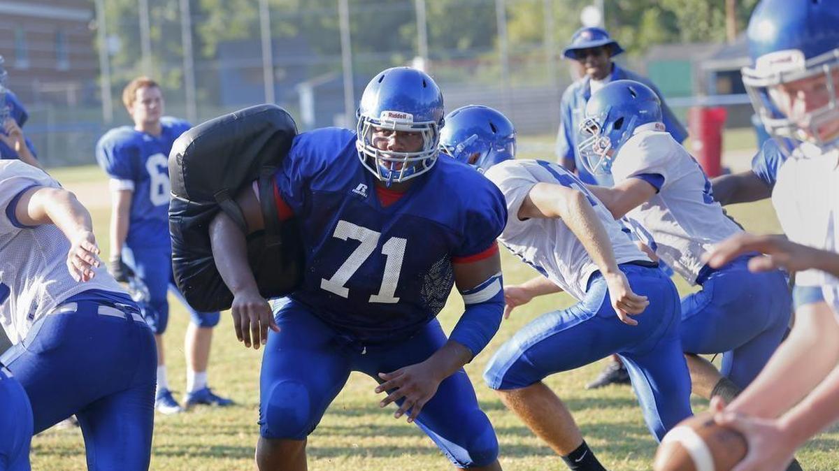 Dexter Lawrence (71) penetrates the line at Wake Forest HS football practice on August 13, 2015. Dexter is the #1-ranked player in the nation, a 6-foot-4, 330-pound defensive lineman.