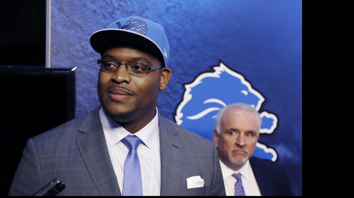 
Detroit Lions first round draft pick guard Laken Tomlinson addresses the media during a news conference on Friday, May 1, 2015 in Allen Park, Mich. At right, is Senior Vice President of Communications Bill Keenist.
