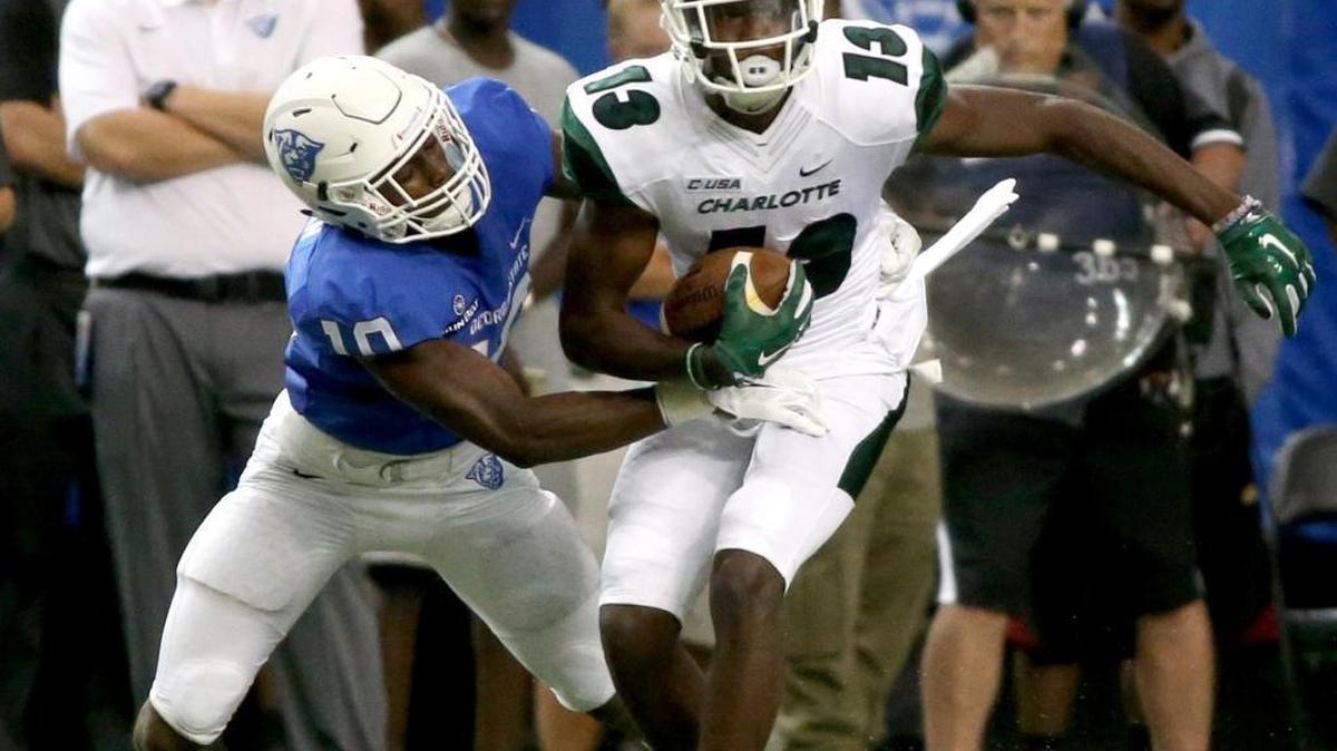 
Georgia State cornerback Chandon Sullivan (10) tackles Charlotte wide receiver T.L. Ford (13) after a reception during the first half of Friday’s game in Atlanta. The 49ers won, 23-30, in their first game as a member of the NCAA Football Bowl Subdivision, college football’s highest level.


