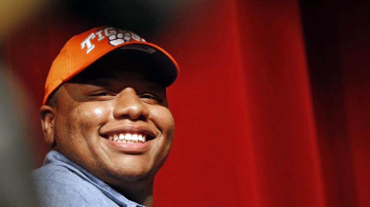 Wake Forest High School football standout Dexter Lawrence flashes a smile after he announced he is headed to Clemson to play college football during an event held at the school in Wake Forest on Dec. 14.