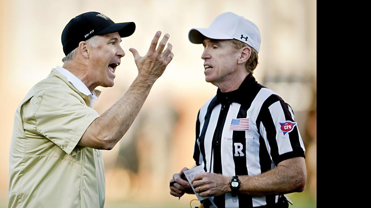 
Wake Forest head coach Dave Clawson argues with referee Pat Garvey after a flag was thrown during the second half of an NCAA college football game against Boston College in Winston-Salem,  Oct. 25, 2014. 
