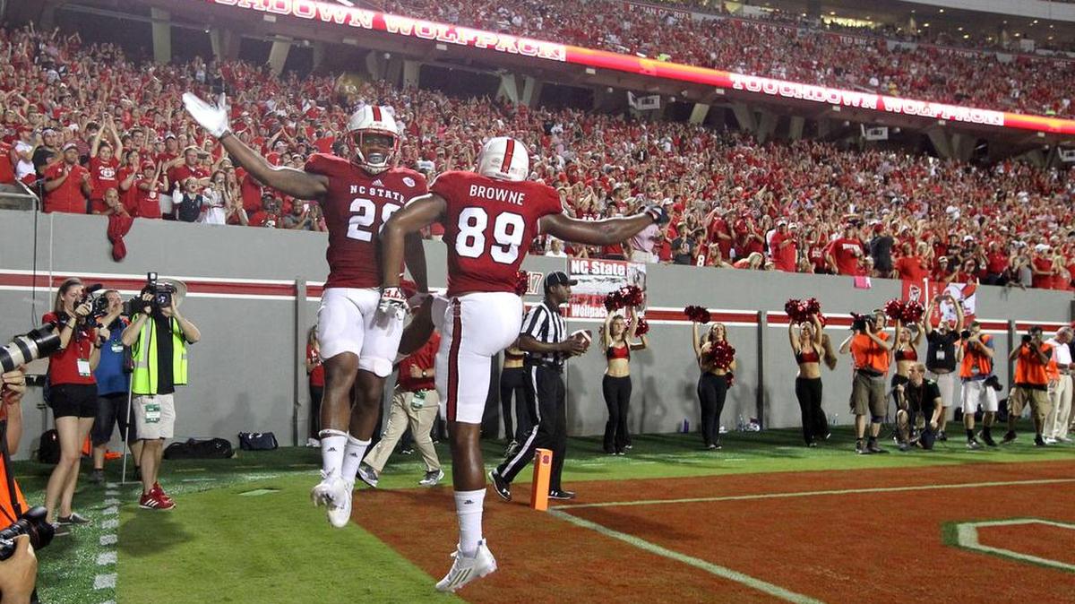 
N.C. State's Jaylen Samuels (28) celebrates with Benson Browne (89) after Samuels scored during the second half of the Wolfpack's 49-21 victory over Troy at Carter-Finley Stadium in Raleigh, N.C., Saturday, Sept. 5, 2015. 
