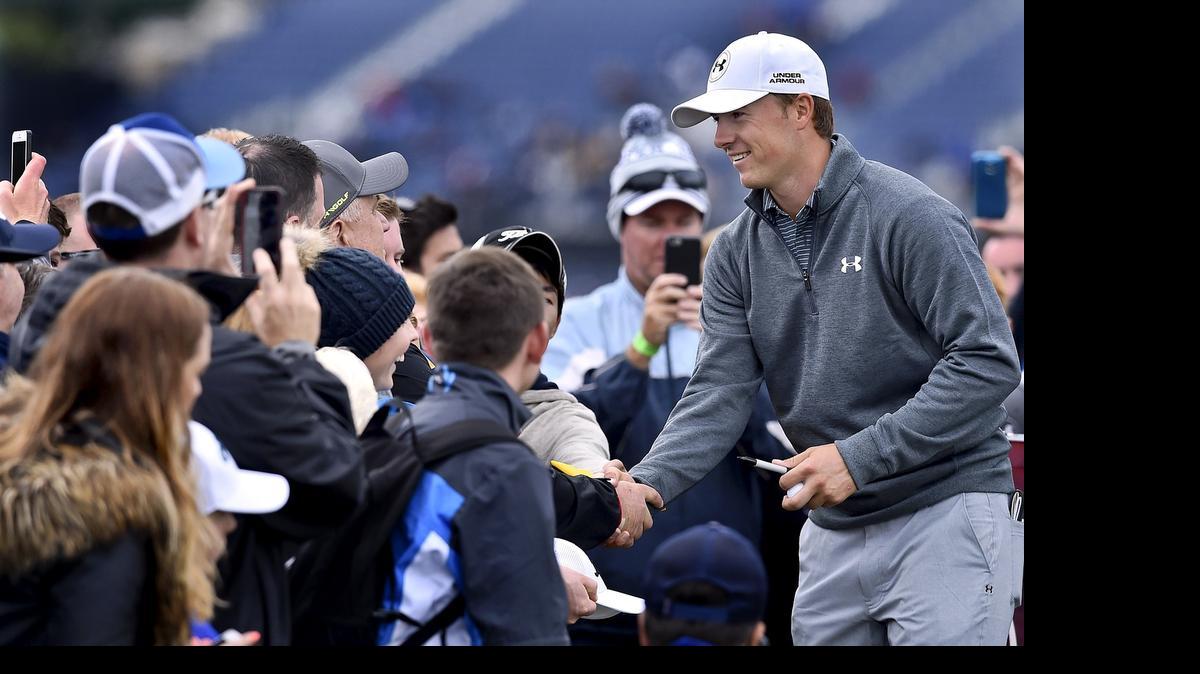 
US golfer Jordan Spieth meets fans on the 3rd tee during a practice round on The Old Course at St Andrews in Scotland, on July 15, 2015, ahead of The 2015 Open Golf Championship which runs July 16-19. US golfer Jordan Spieth arrives at St Andrews with a shot at becoming just the second man - after Ben Hogan in 1953 - to win the first three majors of the year, setting up the mouthwatering prospect of him pulling off the Grand Slam at the PGA Championship next month.
