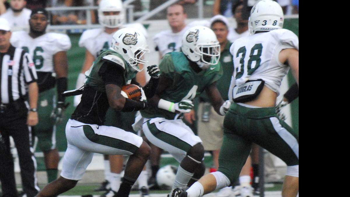 
The Green 49ers Damarrell Alexander drives for the first down at the 49ers’  spring football game at The Richardson Stadium at UNCC in Charlotte, Saturday, April 18, 2015.
