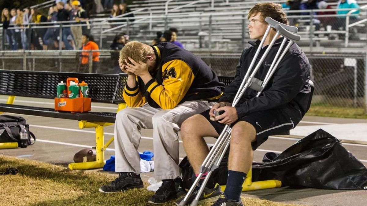 
Chapel Hill’s Coby Fisher (24) returns to the field in the second half in his street clothing after a first-half head injury took him out of a game against the Northwood Chargers in Chapel Hill on Thursday, Oct. 31 2014. He was joined by teammate Brandon Wendel (40), who was out with an ankle injury.
