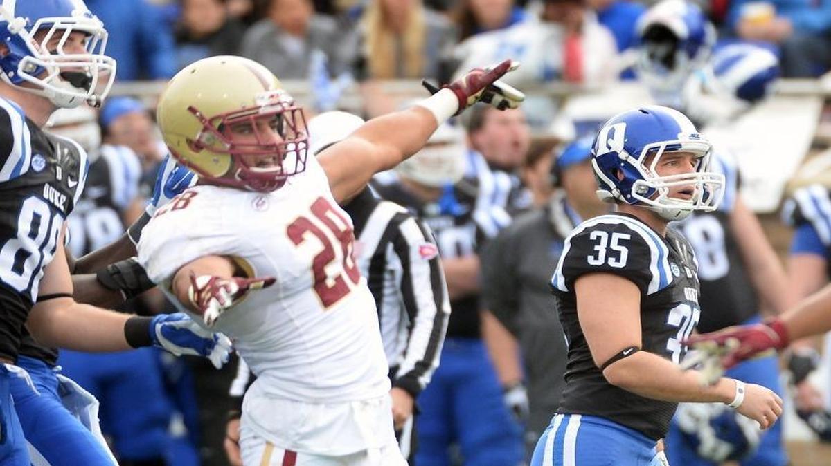 
Boston College linebacker Matt Milano (28) signals “no good” as Duke place kicker Ross Martin (35) watches his kick go through the uprights for his third field goal.
