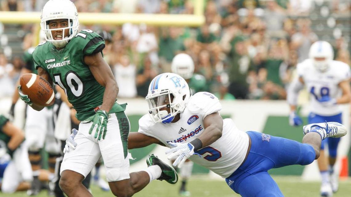 
Charlotte 49ers receiver Austin Duke, left, tries to break away from Presbyterian’s Ed Britt Saturday at Richardson Stadium on the campus. Duke recorded his eighth 100-yard receiving game at Charlotte and finished the afternoon nine catches for 166 yards.

