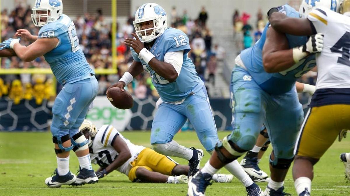 
North Carolina quarterback Marquise Williams (12) scores a touchdown on a seven yard run in the second quarter against Georgia Tech on Saturday, October 3, 2015 in Atlanta, Georgia. 
