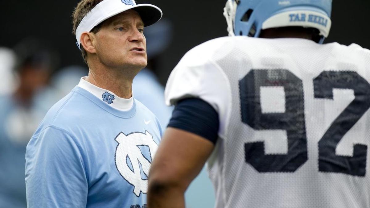 
North Carolina defensive coordinator Gene Chizik instructs Aaron Crawford (92) during the Tar Heels’ practice in August. Chizik and his defense have been practicing for Georgia Tech’s triple option offense since the beginning of the season.



