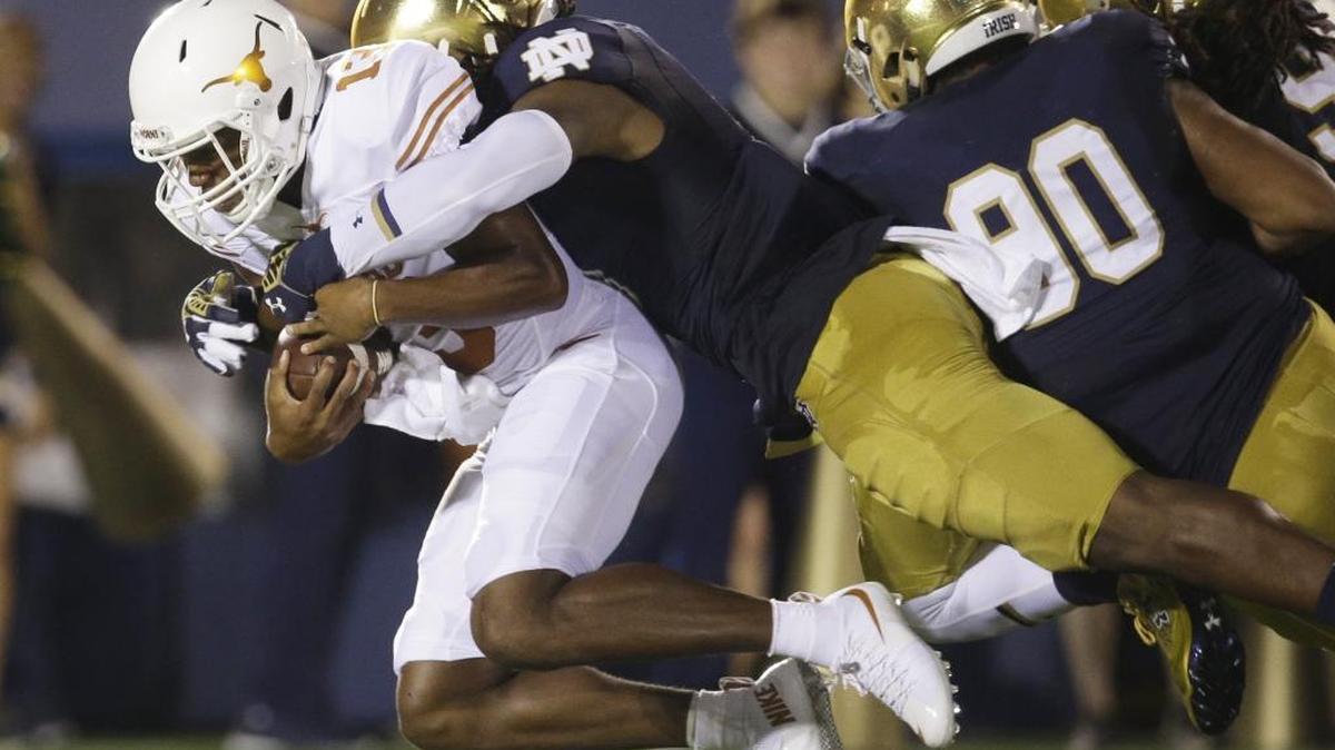 
Notre Dame linebacker Jaylon Smith, center, sacks Texas quarterback Jerrod Heard, left, during the Irish’s season opener on Sept. 5 in South Bend. Ind. Notre Dame faces Clemson Saturday and has upcoming matchups with Southern Cal and Stanford in its 12-game season. 



