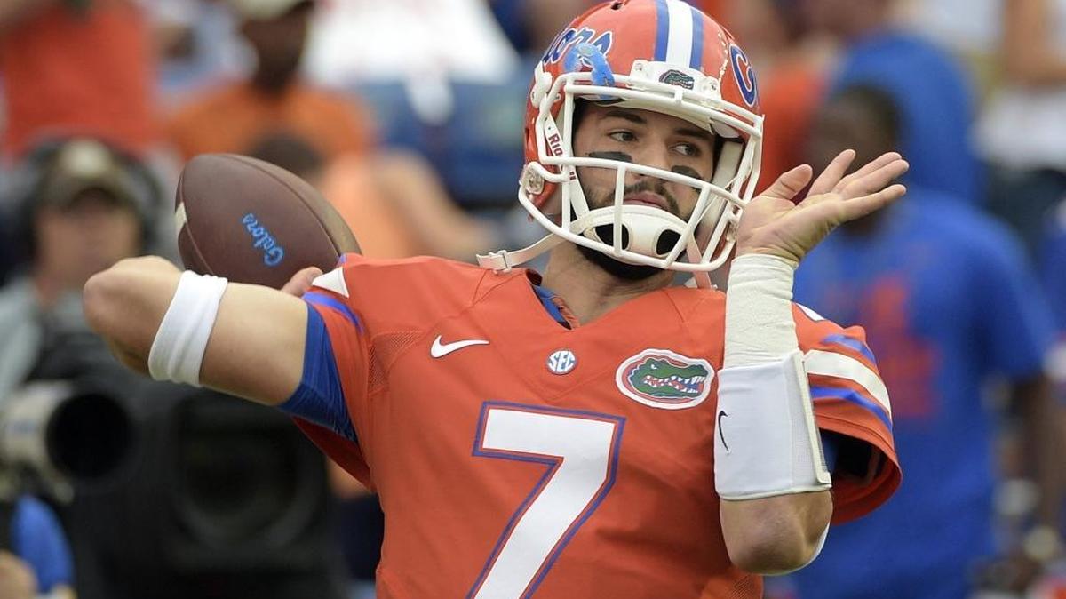 FILE - In this Oct. 3, 2015, file photo, Florida quarterback Will Grier warms up before an NCAA college football game against Mississippi in Gainesville, Fla. A person familiar with the situation says Grier has been suspended indefinitely for violating the NCAA's policy on banned drugs. The person spoke to The Associated Press on condition of anonymity because the school has not announced the decision. Grier is considering an appeal. (AP Photo/Phelan M. Ebenhack, File)