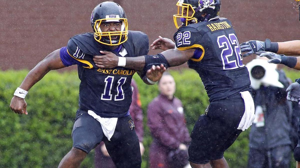 
East Carolina's James Summers (11) celebrates after scoring a touchdown with teammate Chris Hairston (22) during the second half of an NCAA college football game against Virginia Tech in Greenville, N.C., Saturday, Sept. 26, 2015. East Carolina won 35-28. 
