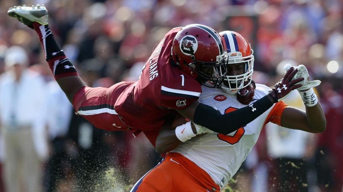 South Carolina’s Deebo Samuel tackles Clemson’s Deon Cain in Saturday’s game at Williams-Brice Stadium in Columbia, S.C.