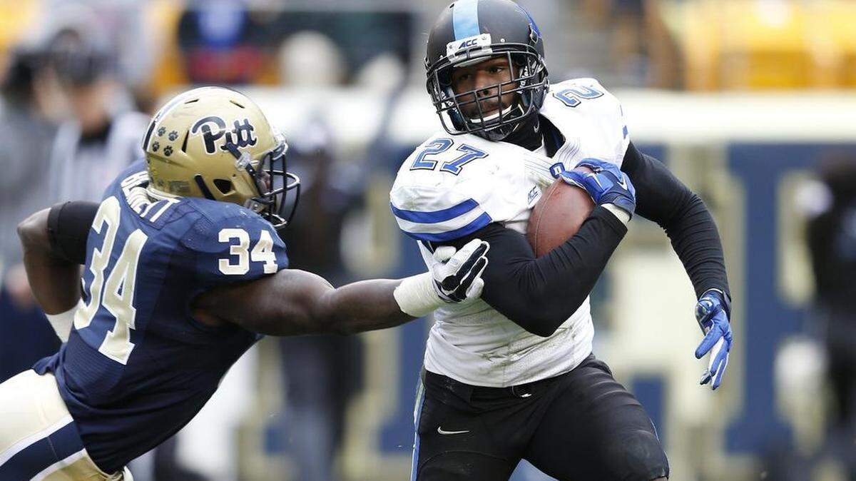 PITTSBURGH, PA - NOVEMBER 1: DeVon Edwards #27 of the Duke Blue Devils returns a kickoff 99 yards for a touchdown in the fourth quarter of the game against the Pittsburgh Panthers at Heinz Field on November 1, 2014 in Pittsburgh, Pennsylvania. Duke defeated Pittsburgh 51-48 in double overtime. (Photo by Joe Robbins/Getty Images)