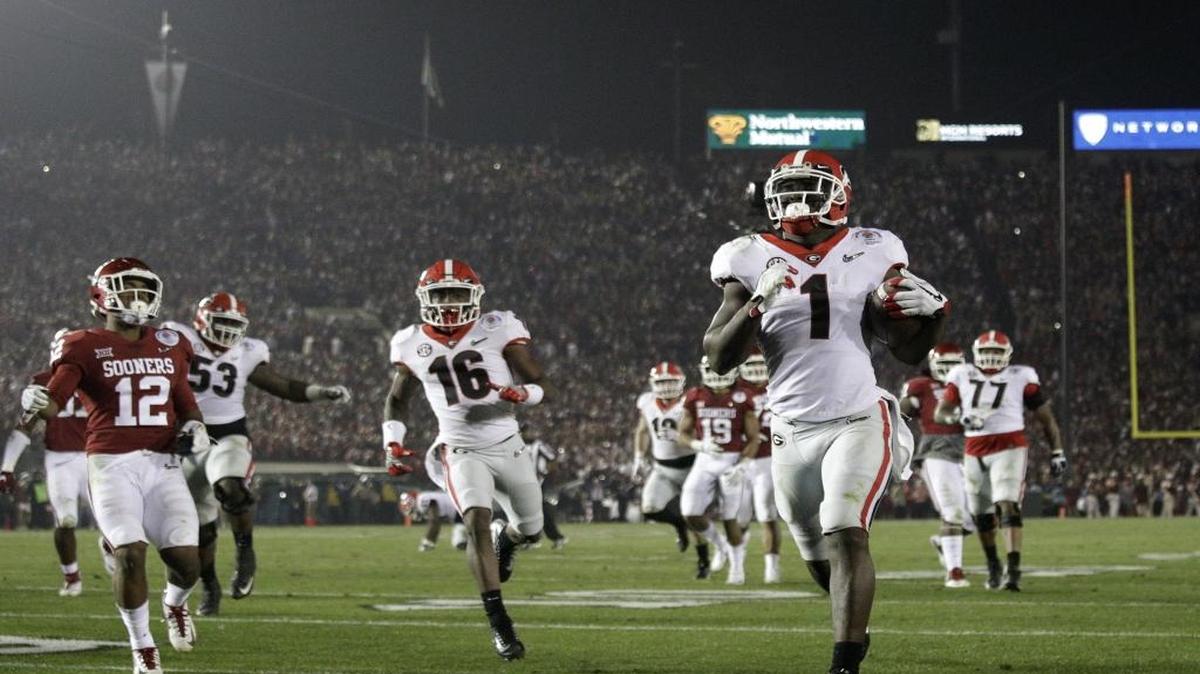 Georgia running back Sony Michel (1) scores a touchdown in overtime against Oklahoma in the Rose Bowl NCAA college football game, Monday, Jan. 1, 2018, in Pasadena, Calif. Georgia won 54-48. (AP Photo/Jae C. Hong)