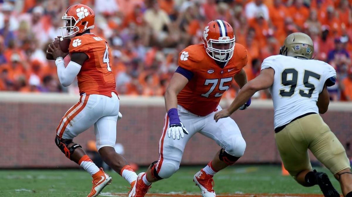 Clemson quarterback Deshaun Watson, left, looks to pass as left tackle Mitch Hyatt (75) blocks Wofford’s Steven Cornellier in a football game in September. Hyatt is the first true freshman to start at left tackle for Clemson since the 1940s.