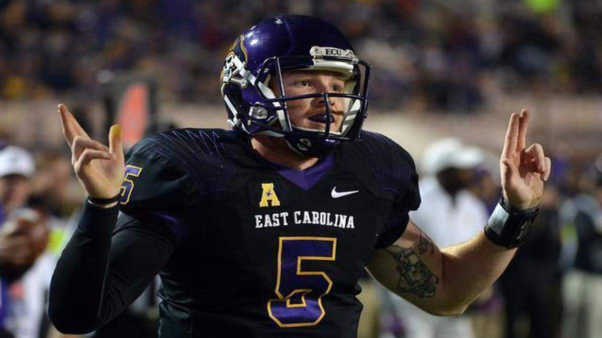 
ECU quarterback Shane Carden (5) reacts after scoring the Pirates’ final touchdown against Tulane. The Pirates beat the Green Wave 34-6 at Dowdy-Ficklen Stadium in Greenville on Saturday, Nov. 22, 2014.
