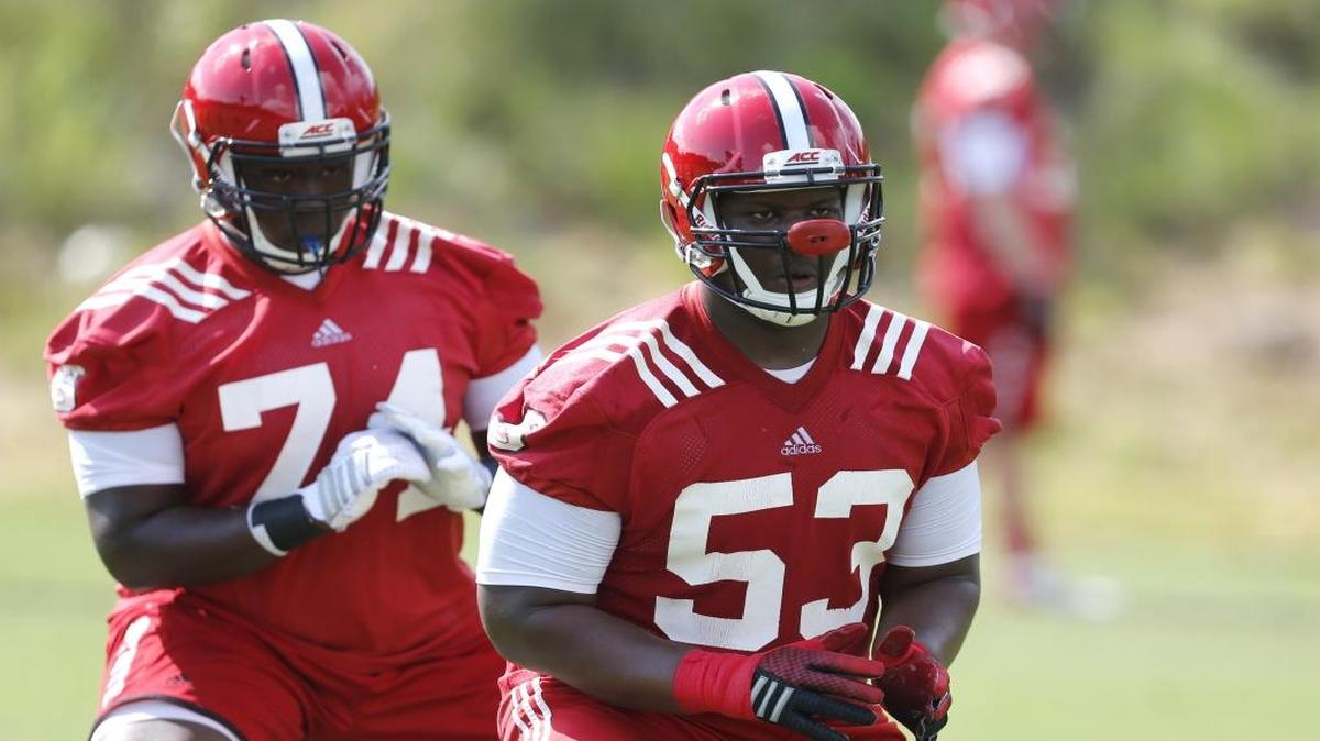 
N.C. State’s Tyler Jones (53), right, and Emanuel McGirt, Jr. (74) do drills during the Wolfpack’s first preseason football practice Tuesday, Aug. 4, 2015, in Raleigh.
