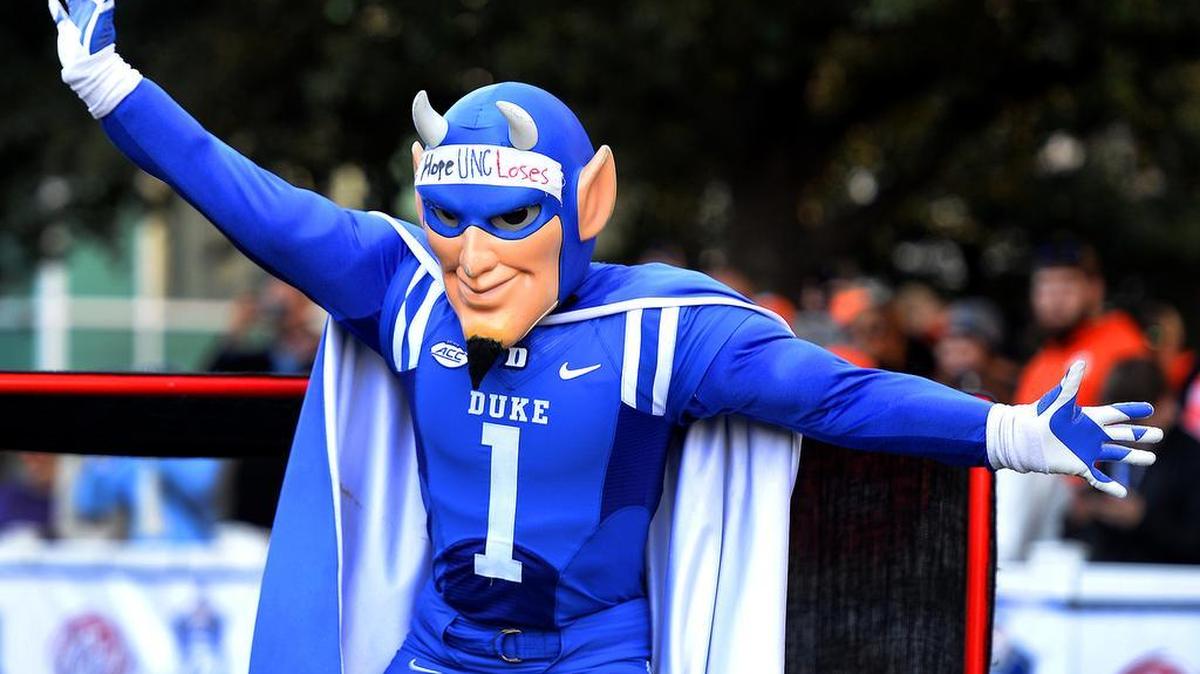 Even though the two teams are not competing against one another, the Duke Blue Devils mascot wears a strip of tape reading, “I hope UNC Loses,” during the ACC Mascots skills clinic outside of Bank of America Stadium in Charlotte, NC prior to the 2015 Dr Pepper ACC Football Championship on Saturday, December 5, 2015. Clemson plays the UNC Tar Heels in the championship game.