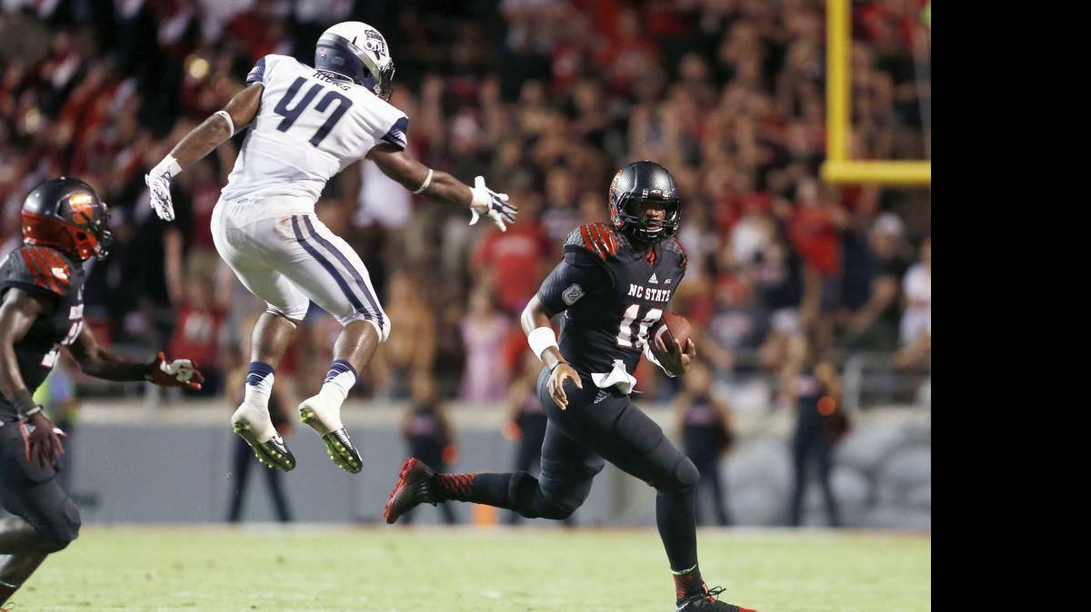 
Old Dominion linebacker TJ Ricks (47) goes after N.C. State quarterback Jacoby Brissett in a 2014 game.
