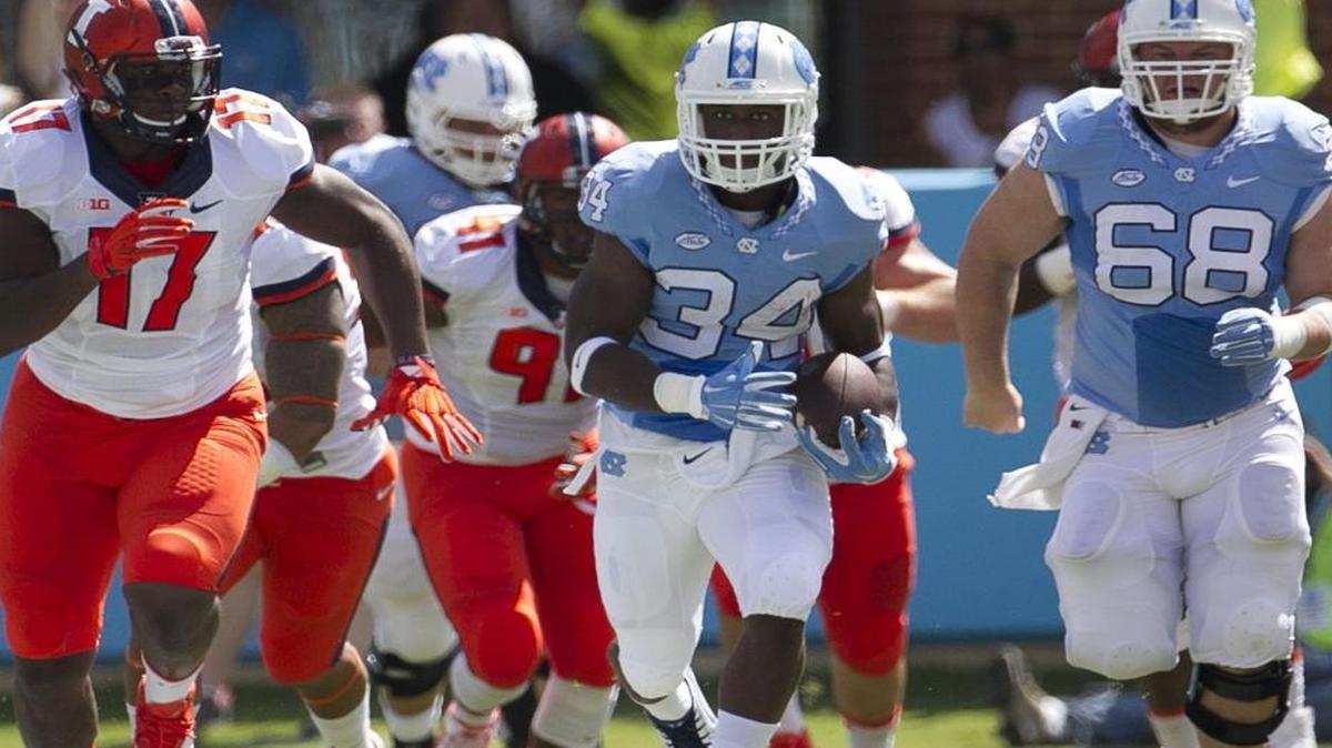 
North Carolina tailback Elijah Hood (34) breaks into the open field for a 39-yard gain in the first quarter against Illinois on Saturday at Kenan Stadium in Chapel Hill.
