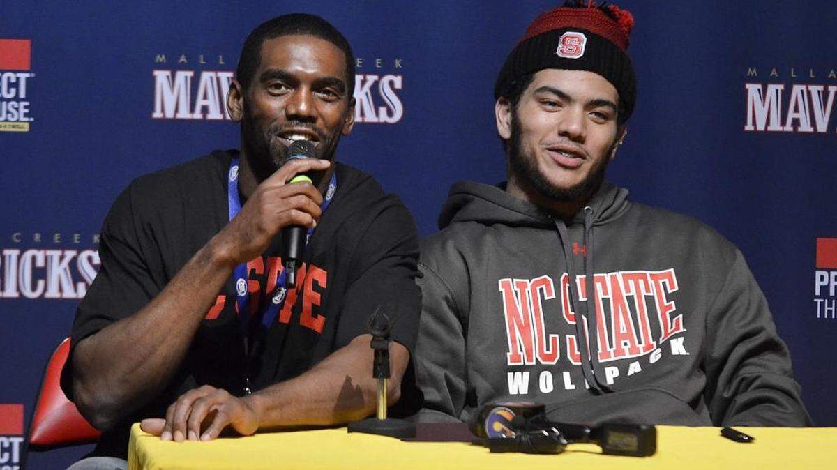 Former NFL great Randy Moss, left, took the microphone after son Thaddeus Moss, a tight end at Mallard Creek, signed with N.C. State Wednesday morning.